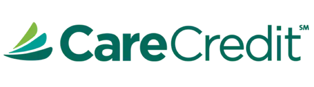 Portrait of Dr. Tej Lad Smiling and Wearing a Suit with a Soft Brown Background at One Eleven Dental Care