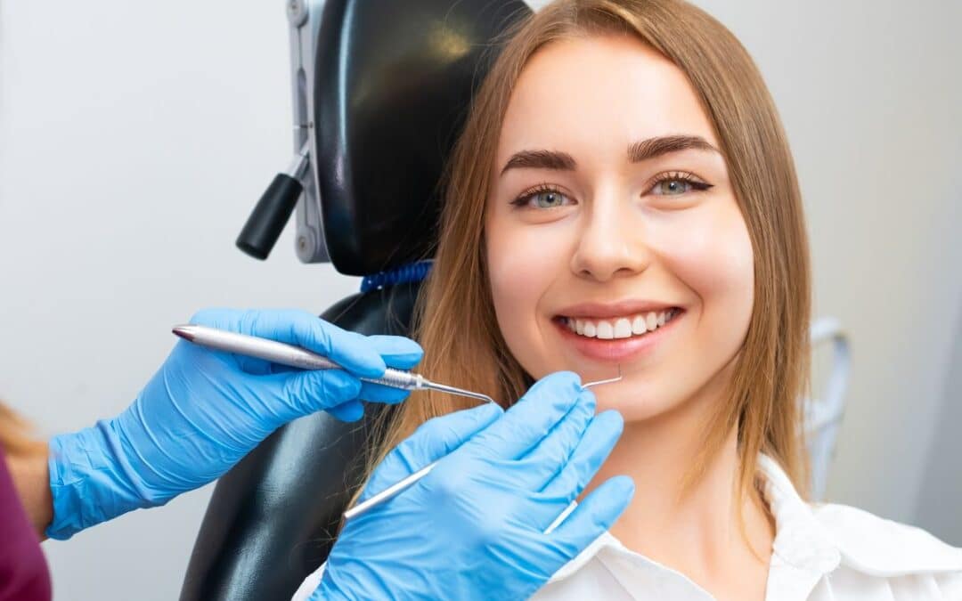 Female patient receiving a routine dental checkup